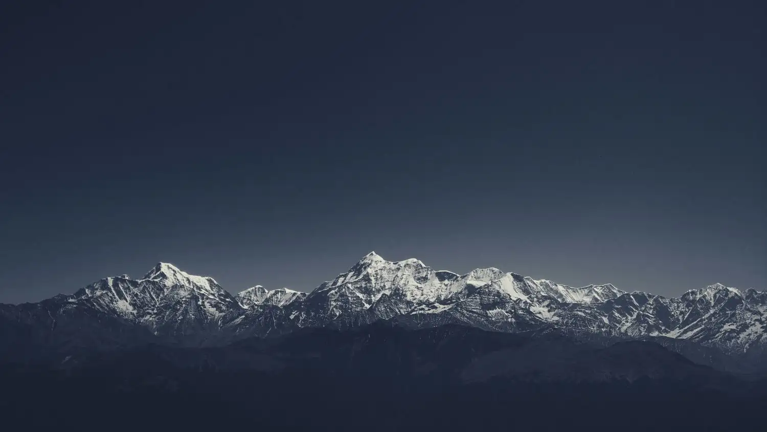 Snow-capped Himalayan mountain range at dusk, the remote high-altitude origin of spikenard root