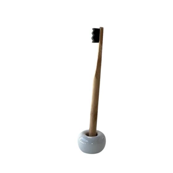 Olgani Naturals SoftWave bamboo toothbrush in ceramic stand — soft wave charcoal bristle eco-friendly toothbrush available at Toeka